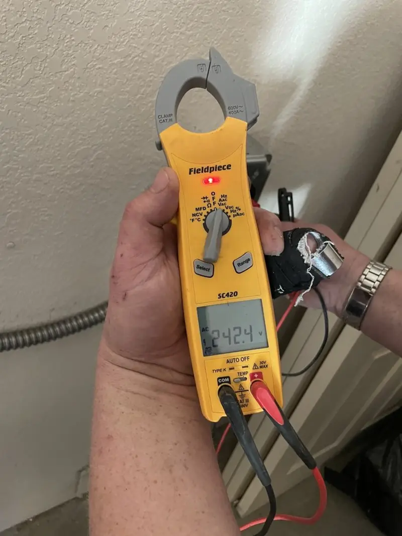 Voltage testing with clamp meter during Generator Installation in Woodridge